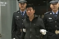 Fugitive returns to China after 15 years on the run