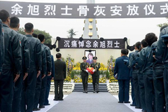 Ashes of fallen pilot placed in hometown cemetery