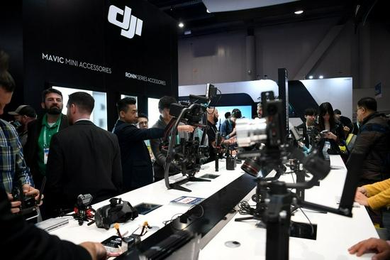 People visit Chinese drone maker DJI's booth at the 2020 Consumer Electronics Show (CES) in Las Vegas, the United States, Jan. 8, 2020. (Xinhua/Wu Xiaoling)