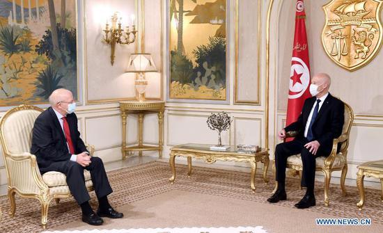 Tunisian President Kais Saied (R) meets with visiting Portuguese Foreign Minister Augusto Santos Silva in Tunis, Tunisia, Dec. 17, 2020. Tunisian President Kais Saied on Thursday discussed with visiting Portuguese Foreign Minister Augusto Santos Silva the ways to boost cooperation and diversify its fields, the Tunisian Presidency said in a statement. (Tunisian Presidency/Handout via Xinhua)
