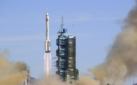 The crewed spacecraft Shenzhou-12, atop a Long March-2F carrier rocket, is launched from the Jiuquan Satellite Launch Center in northwest China's Gobi Desert, June 17, 2021. (Xinhua/Ju Zhenhua)