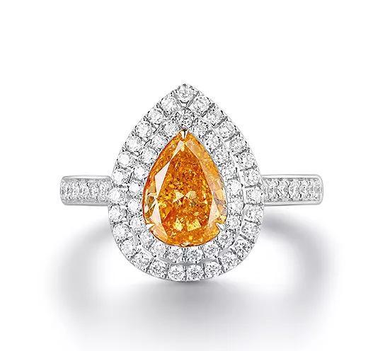 FANCY VIVID YELLOWISH ORANGE DIAMOND AND DIAMOND RING