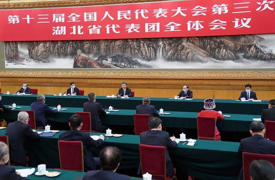 5月24日,中共中央总书记、国家主席、中央军委主席习近平参加十三届全国人大三次会议湖北代表团的审议。新华社记者 李学仁 摄