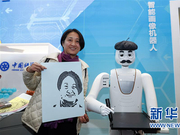 在改革开放40周年展览上体验科技互动