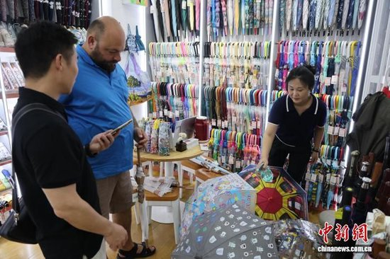 (年终特稿)免签再扩圈 中外人员往来迎新利好