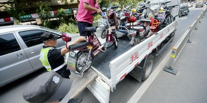电动车被扣车主告赢交警大队 强制措施程序被