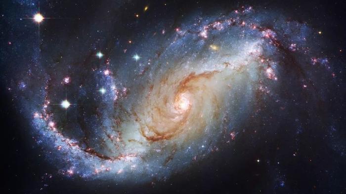 银河系为什么会自转？最新发现：星系旋转的方向取决于质量！