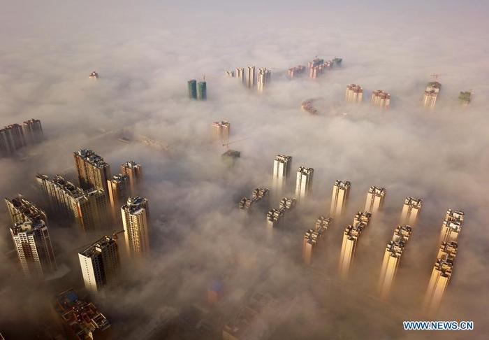 Aerial photo taken on Jan. 14, 2021 shows the scenery of advection fog in Weining County, southwest China's Guizhou Province. (Xinhua/Yang Wenbin)