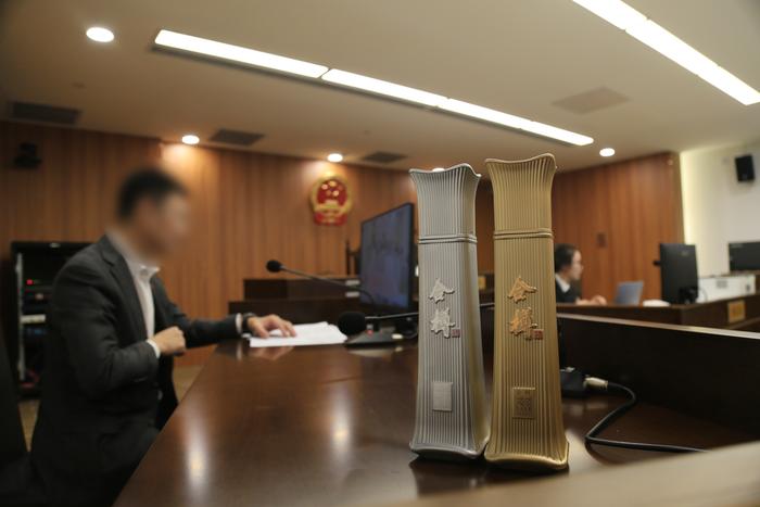 白酒瓶仿照北京第一高楼外形被判赔45万!法院:侵犯建筑作品著作权