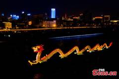 Huge dragon lantern lights up Fenhe River in Shanxi