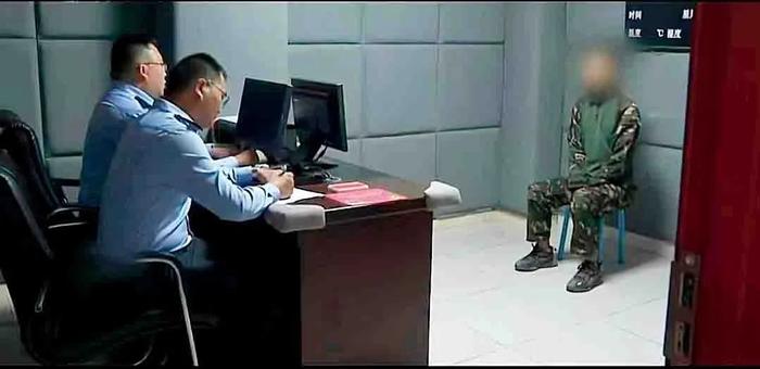(视频截图)凉山州警方调查“韩文团队”的赵某进。