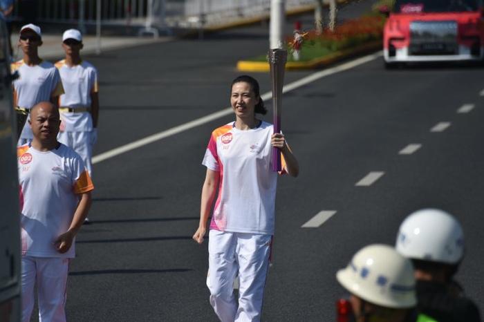 心手相连点燃梦想——写在杭州亚运会火炬传递活动收官之际