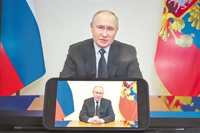 这是3月23日在俄罗斯首都莫斯科拍摄的俄罗斯总统普京发表讲话的视频画面。