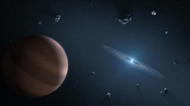 艺术示意图,围绕白矮星运行的一颗系外行星,白矮星周围包裹着一个残骸物质构成的盘状物