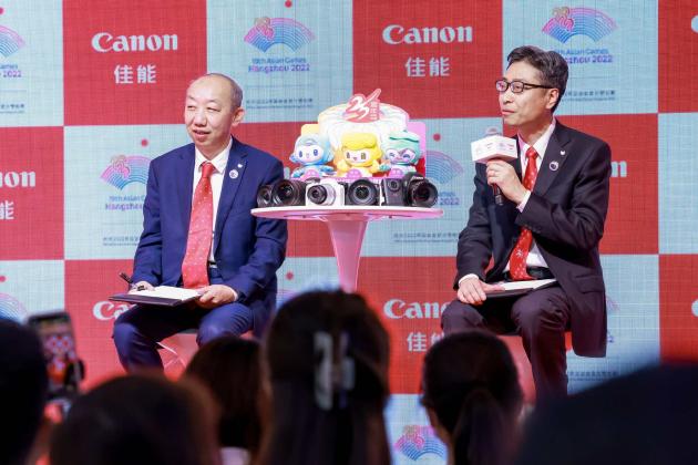 佳能(中国)有限公司影像信息商务统括本部的高级总经理王川与项目副总经理栗开宇