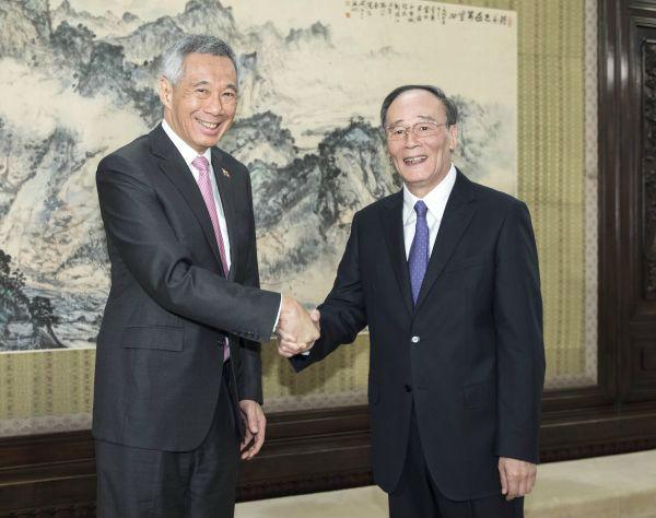 9月20日,中共中央政治局常委、中央纪委书记王岐山在北京会见新加坡总理李显龙。新华社