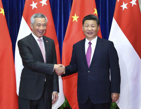 9月20日,国家主席习近平在北京人民大会堂会见来华进行正式访问的新加坡总理李显龙。新华社