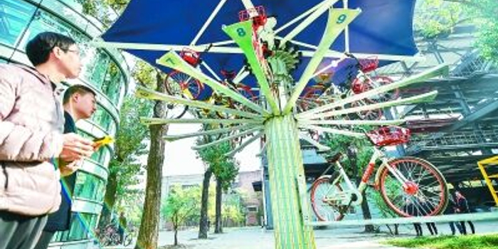 首钢研制共享单车立体车库 空中停车还了得?