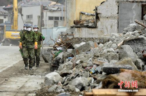 资料图:日本2011年的“3·11东北大地震”和海啸灾难后,当地遭到严重损毁。中新社发 侯宇 摄