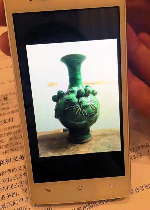 付先生只有一张陶瓶未损坏前的照片，此外已无其他证据
