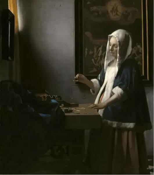 《拿秤的女人》约1664年。 约翰内斯·维米尔 © Washington， National Gallery of Art