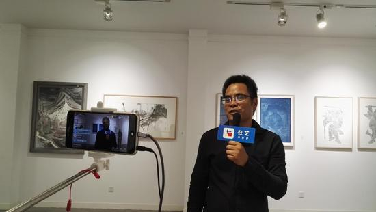 策展人长风接采访