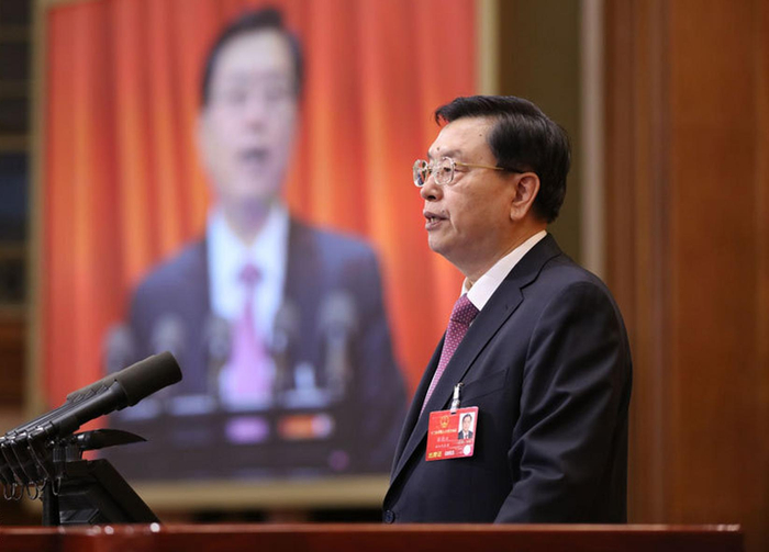 全国人大常委会委员长张德江作全国人民代表大会常务委员会工作报告。