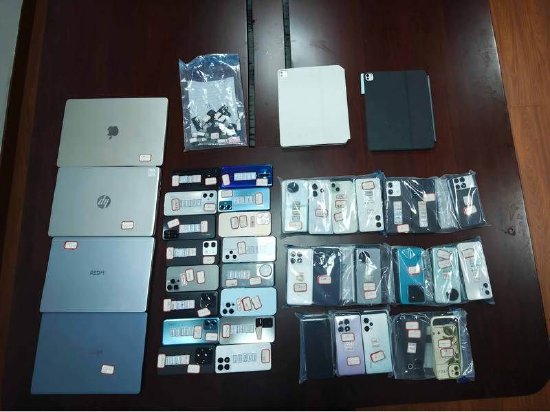 警方查获的作案用电脑。上海警方供图