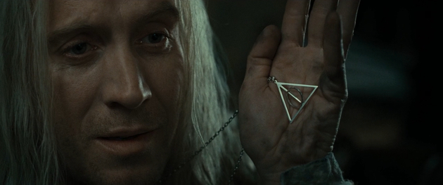 卢娜爸爸展示死亡圣器的标志