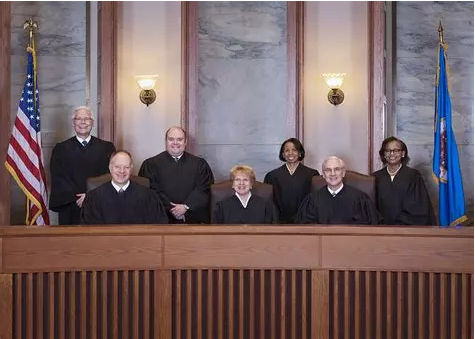 注：明尼苏达州法院法官，但目前这个案子上升不到州法院一层