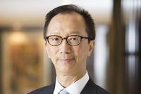 梁锦松:金融危机的土壤已经存在 港元有压力但死不了