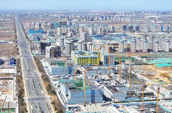这是2026年3月18日拍摄的位于雄安新区起步区第五组团的首批北京疏解高校雄安校区建设现场（无人机照片）。新华社记者 朱旭东 摄