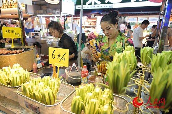 酸辣可口的“芒果花”。人民网 雷琦竣摄