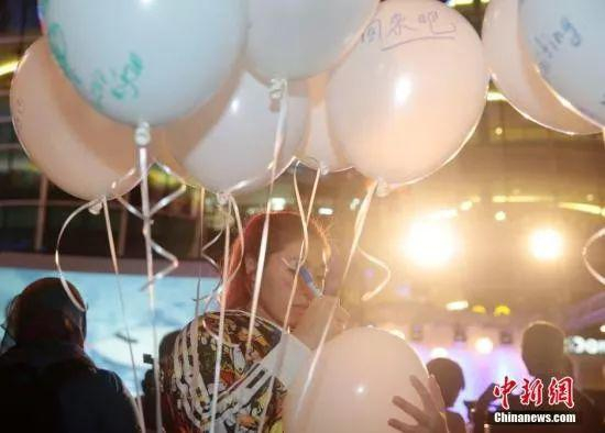  资料图：马来西亚各界人士为失联航班MH370祈福 中新社 刘关关 摄