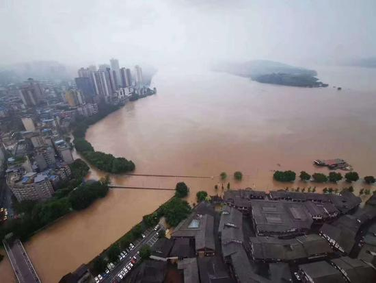 19日8时，重庆巴南区鱼洞滨江大桥被淹。重庆市水利局供图