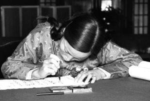 1954年，出席第一届全国人代会的申纪兰在报到表上签字