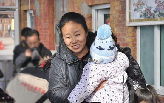  （图：“爱心妈妈”李利娟资料图片。）