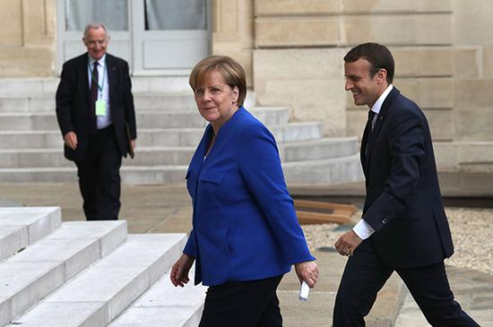 默克尔与马克龙。视觉中国 资料