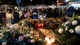 民众悼念瑞士酒吧火灾遇难者