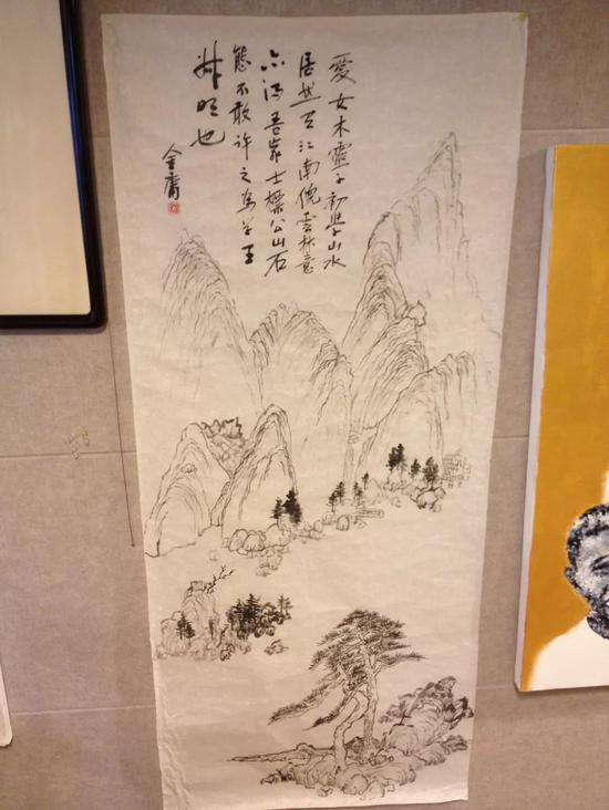 ▲金庸题字，查传讷作山水画