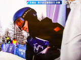 【苏翊鸣获得单板坡面障碍技巧滑雪冠军】2026年2月18日。电视画面