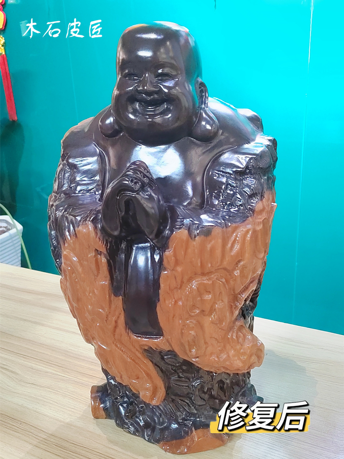 西安网友的木雕弥勒佛全身多处开裂修复完工