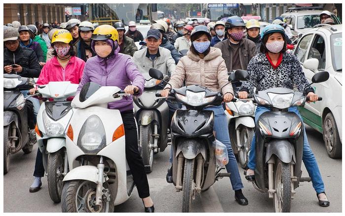 越南当地的女孩，为什么大多侧身乘坐摩托车，而不是跨着坐？