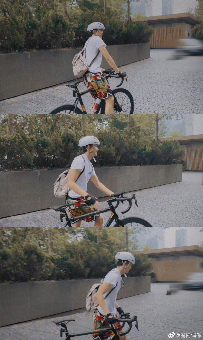 吴磊最新骑车侧拍好熟悉的花短裤造型又骑车上班了