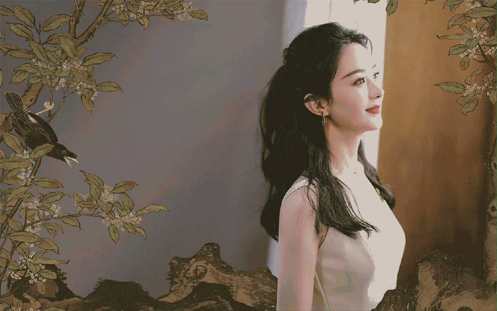 赵丽颖长发披肩气质佳身穿素色宽肩吊带裙手持花卉十分端庄优雅