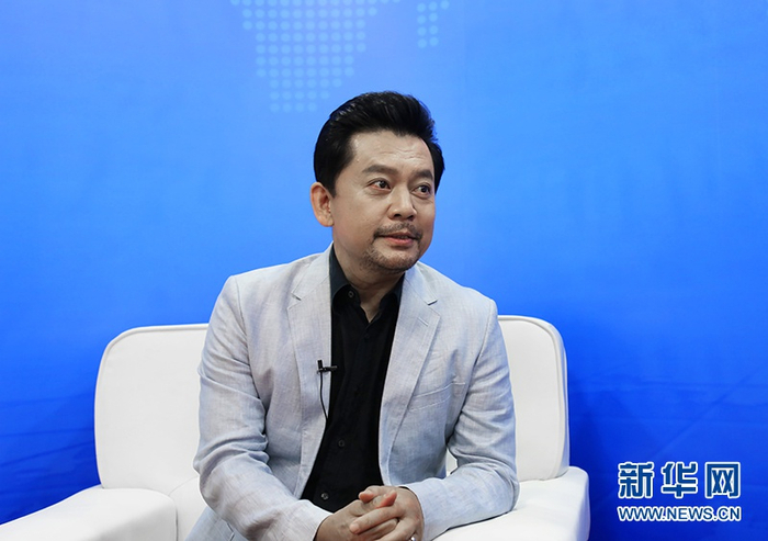 何政军在“5·10中国品牌日消费节”接受采访。新华网 韩攀 摄