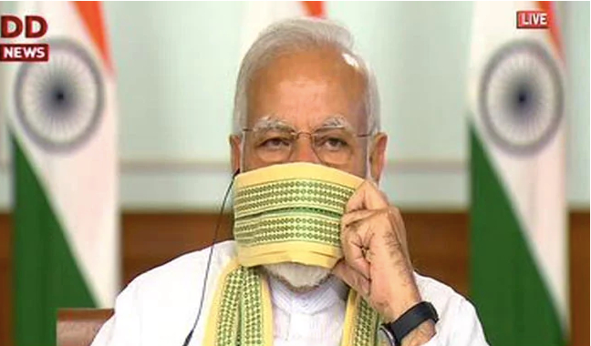 莫迪用传统围巾做防护。/DD news