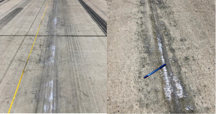 白色的发动机舱在跑道上高速直接摩擦所留下的痕迹