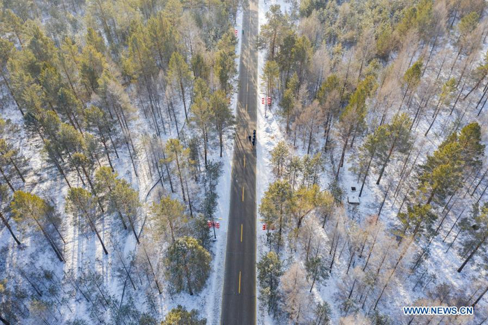 Aerial photo shows firefighters exercising in Beiji Village of Mohe City, northeast China's Heilongjiang Province, Jan. 13, 2021. Firefighters stick to their post and keep training despite the freezing weather in Mohe, the northernmost city in China, where the temperature is often below minus 40 degrees Celsius in winter. (Xinhua/Xie Jianfei)