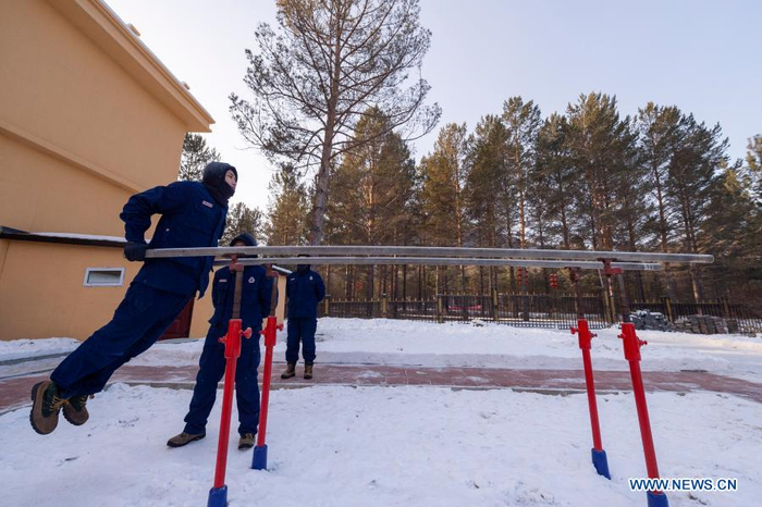 Firefighters exercise at the fire station in Beiji Village of Mohe City, northeast China's Heilongjiang Province, Jan. 13, 2021. Firefighters stick to their post and keep training despite the freezing weather in Mohe, the northernmost city in China, where the temperature is often below minus 40 degrees Celsius in winter. (Xinhua/Xie Jianfei)